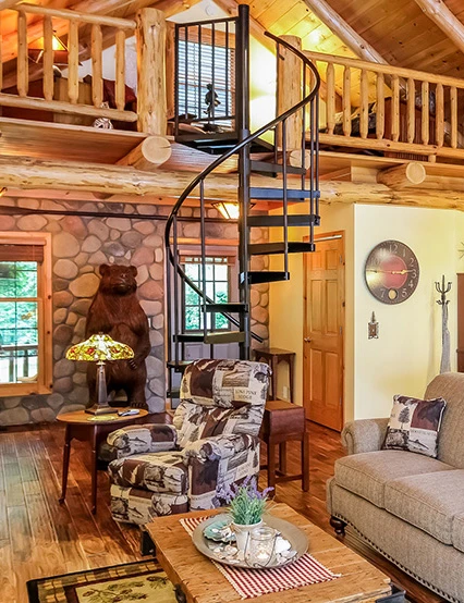 open frame spiral staircase kit in rustic wood frame cabin