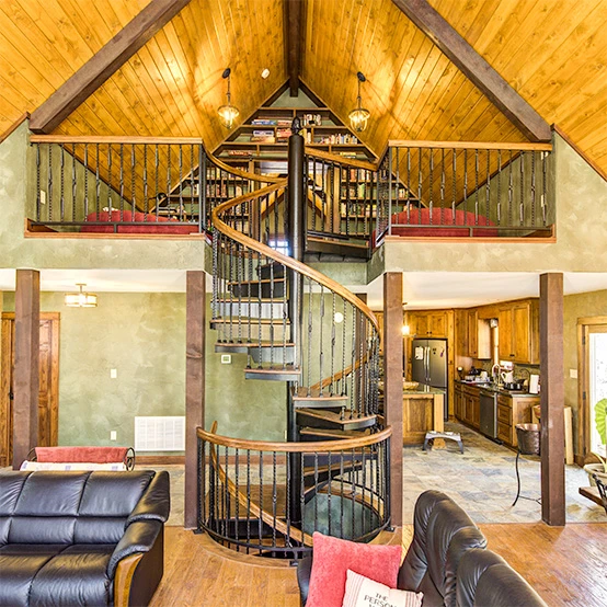 multi story rustic living room spiral stair