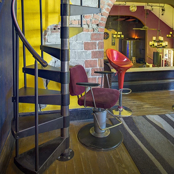 easy installation spiral staircase in urban artists loft with exposed brick