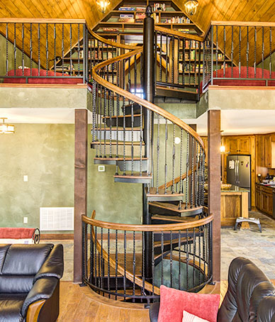 multi story rustic living room spiral stair