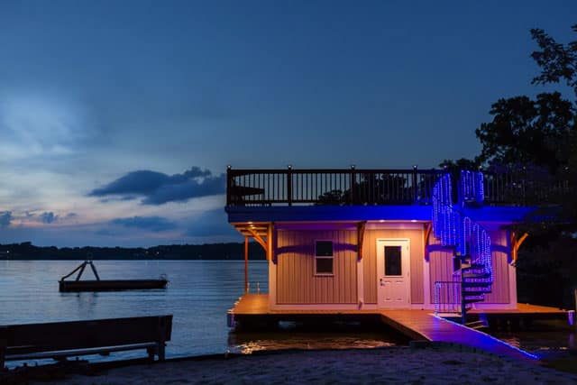 nighttime boat house with dock