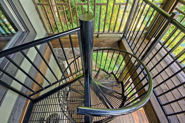 powder coated spiral staircase on lake house
