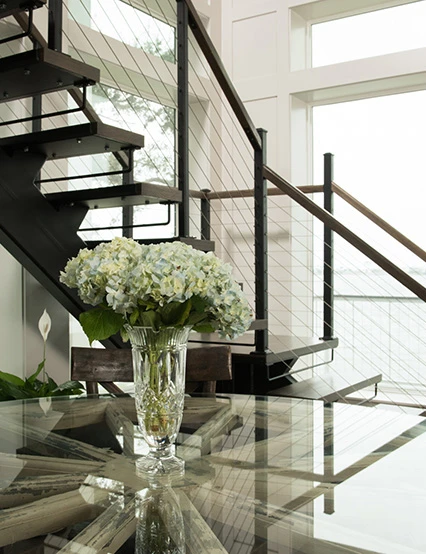 monostringer floating staircase with steel stringer and solid wood treads