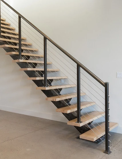 mono stringer floating stair with light wood treads and modern cable rail