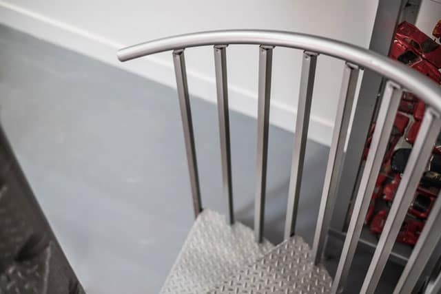 industrial steel spiral stair railing detail shot
