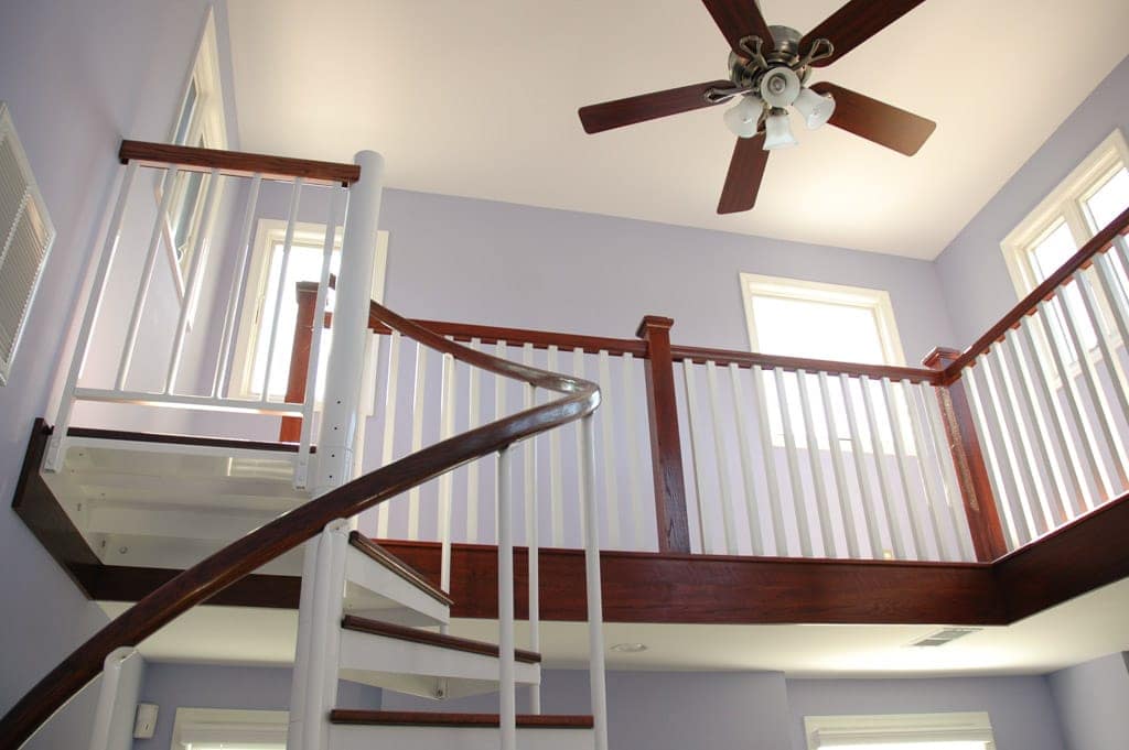 matching loft railing with wood handrail