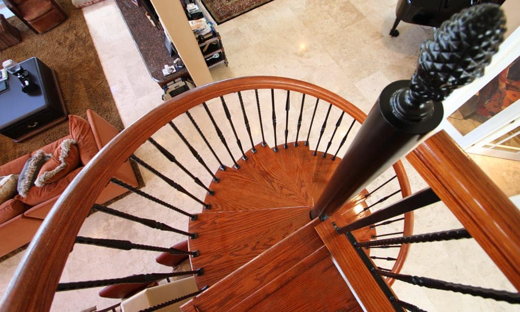 steel spiral stair with solid wood steps and platform