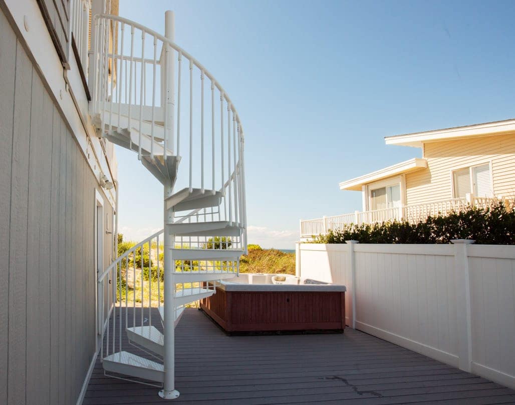 spiral stair from upper level deck to lower patio