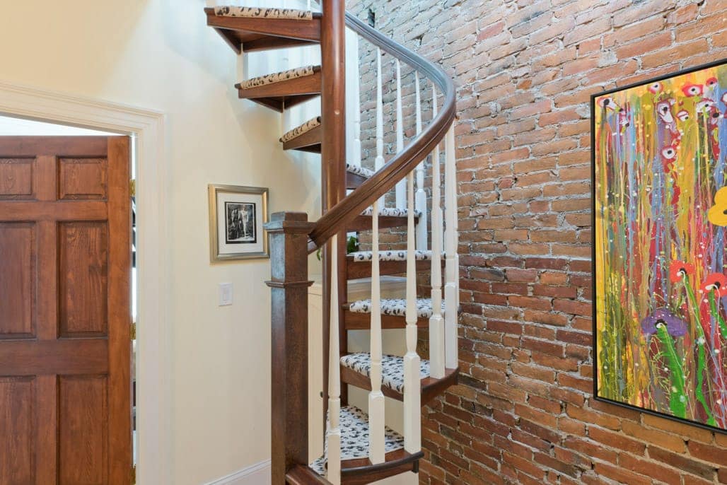 compact wood spiral stair in townhouse