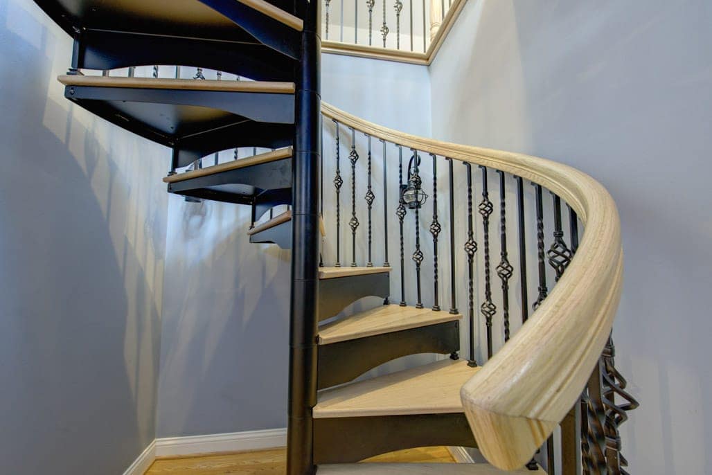 forged iron spiral stair with pine steps