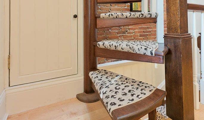 wooden spiral staircase with a simple frame