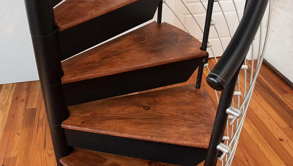 steel spiral stair with wood accents