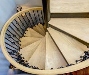 iron spiral stair with ornamental balusters