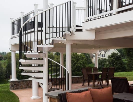 outdoor spiral stair with matching deck railing
