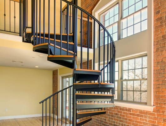 primed steel spiral stair with oak steps