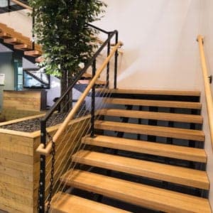 metal straight staircase with wooden accents
