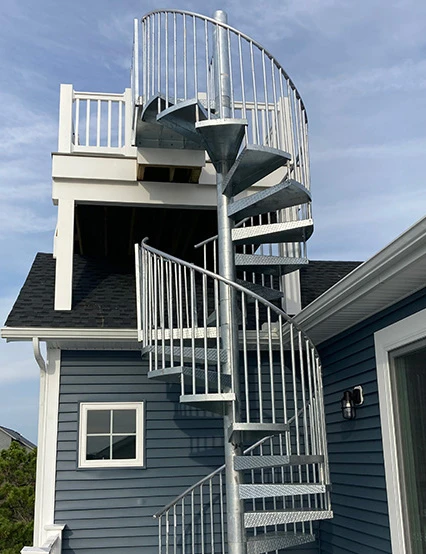 two story outdoor galvanized spiral staircase on beach house