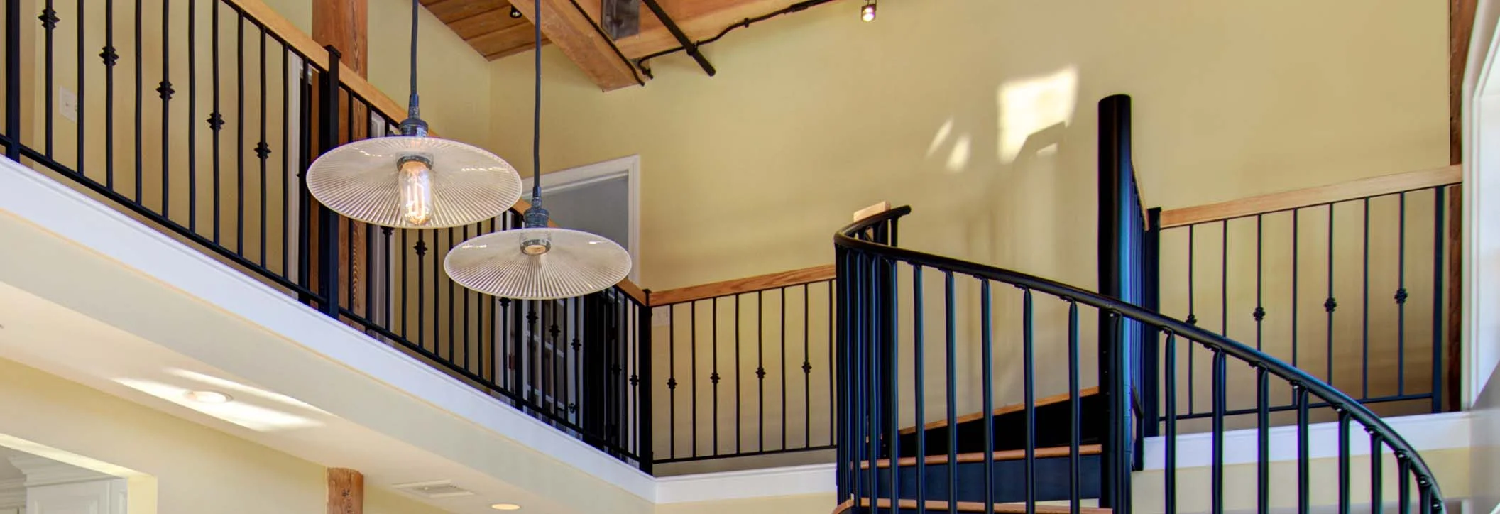 classic steel spiral staircase with twisted cage loft railing