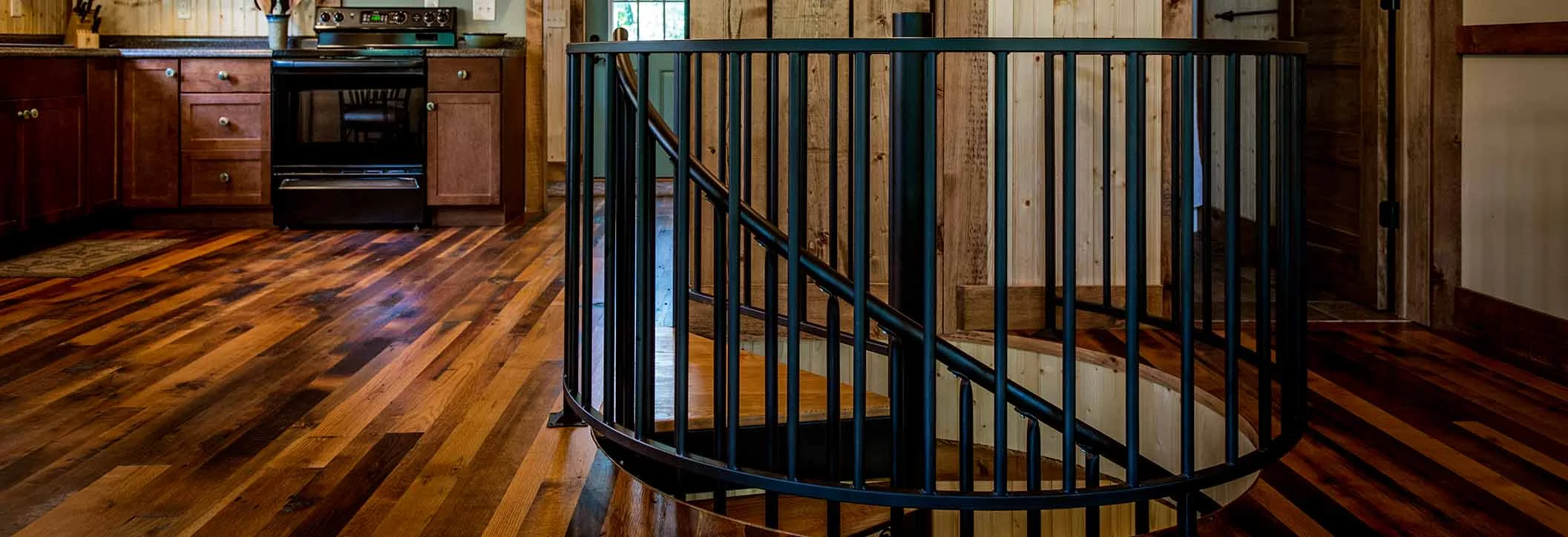 classic steel spiral staircase with well opening railing