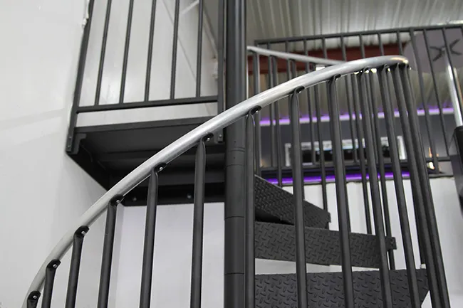 monochromatic steel spiral stair to modern loft