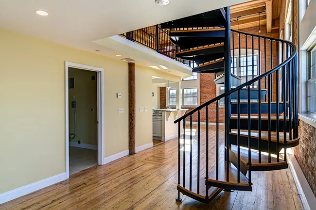 warm wood spiral stair with steel frame